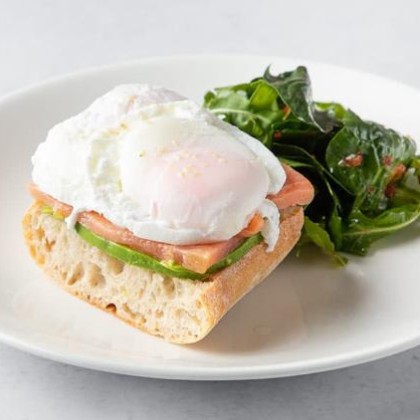 Eggs Benedict with salmon on ciabatta bread